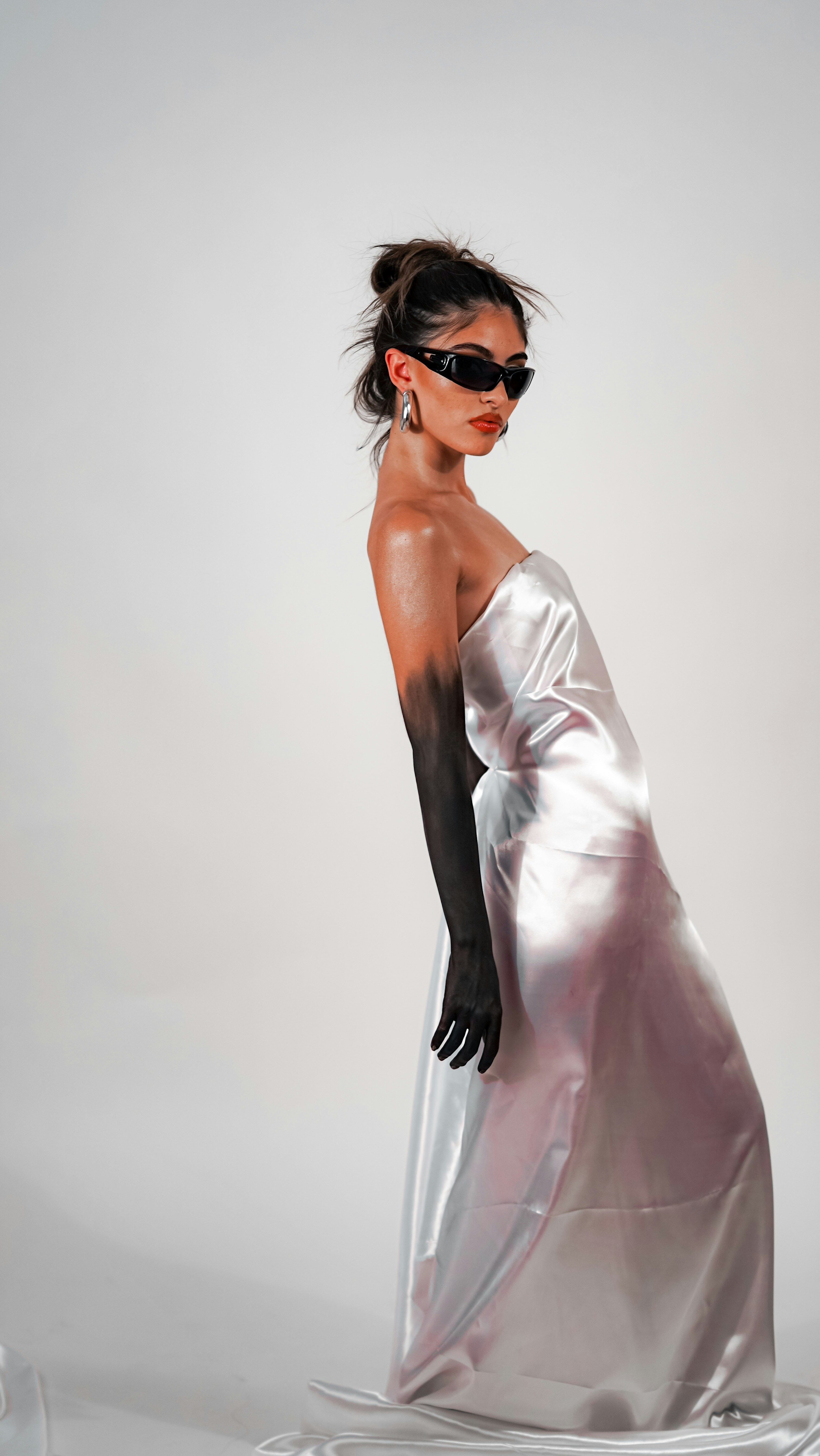 A metallic-dress editorial portrait